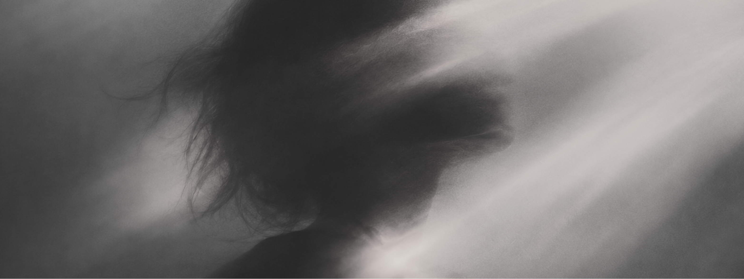 Aether Consciousness banner showing a dark human profile with soft vertical light and shadow