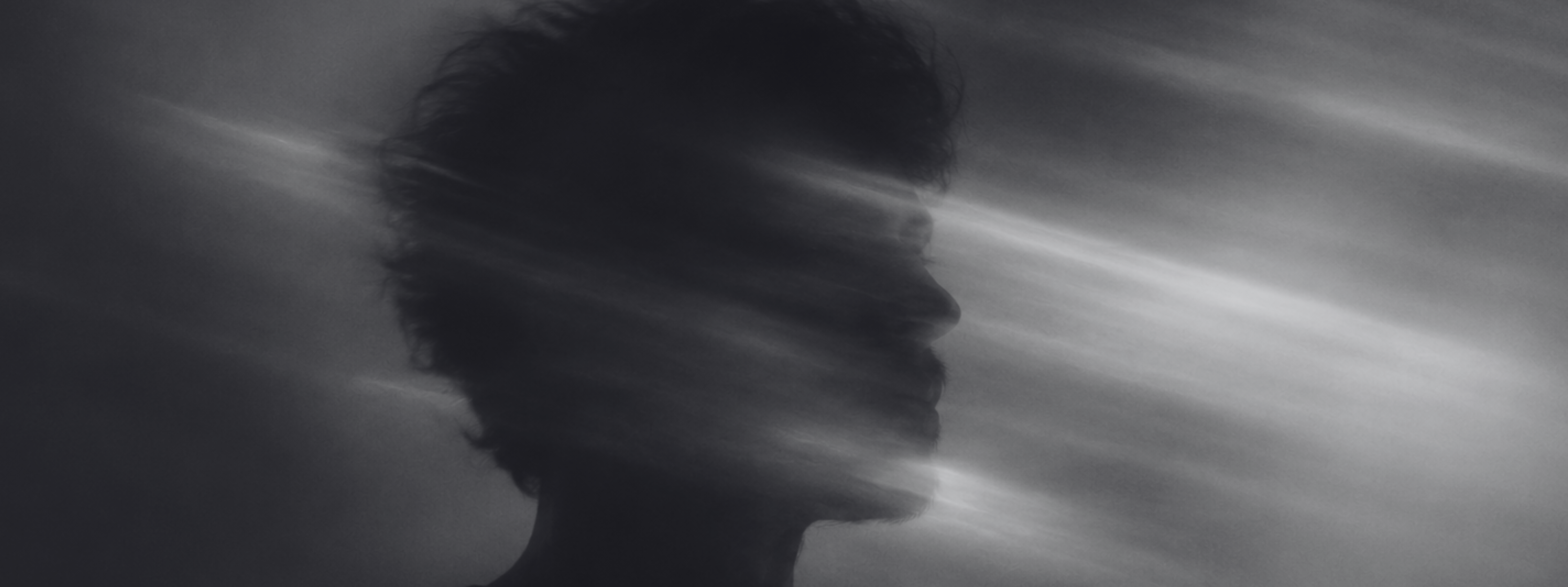 Aether Dream States banner showing a dark human profile surrounded by soft blurred light and shadow