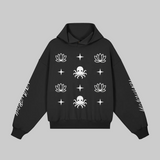 Front-facing view of the black Soul Supremacy Snap Button Collar Hoodie Encoded Motifs with Nova Nobody sleeve marks